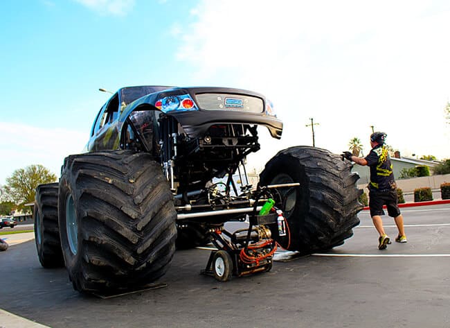 http://www.sandytoesandpopsicles.com/wp-content/uploads/2015/01/monster-jam-2015-anaheim-menace-getting-tires.jpg