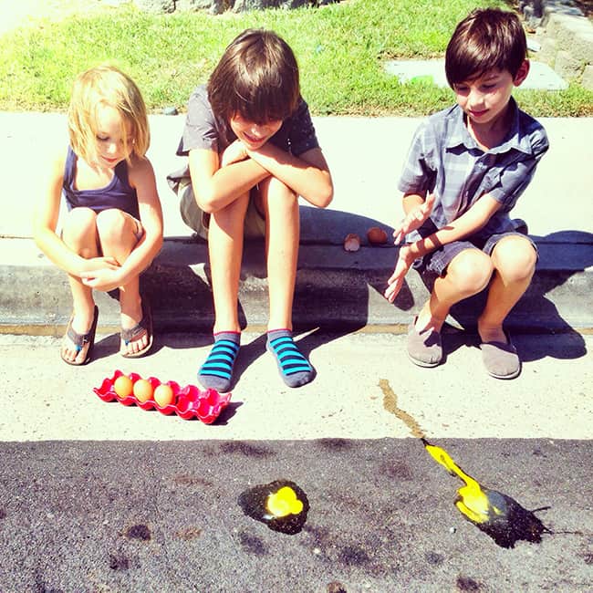 cooking an egg on the sidewalk