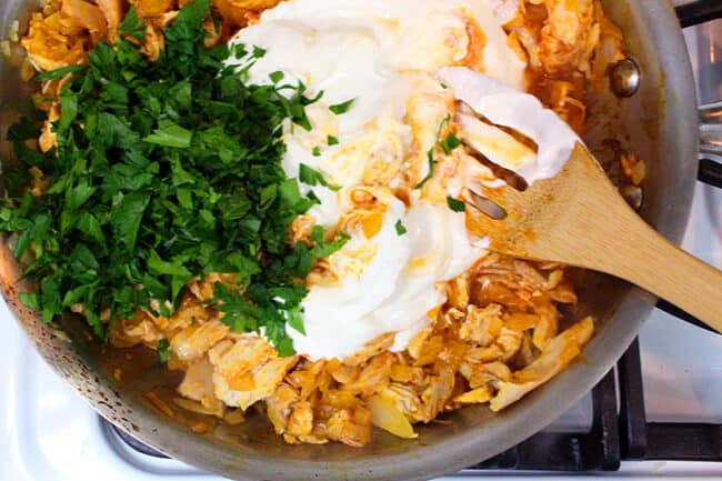 Showing how to mix enchilada ingredients on the stove top.