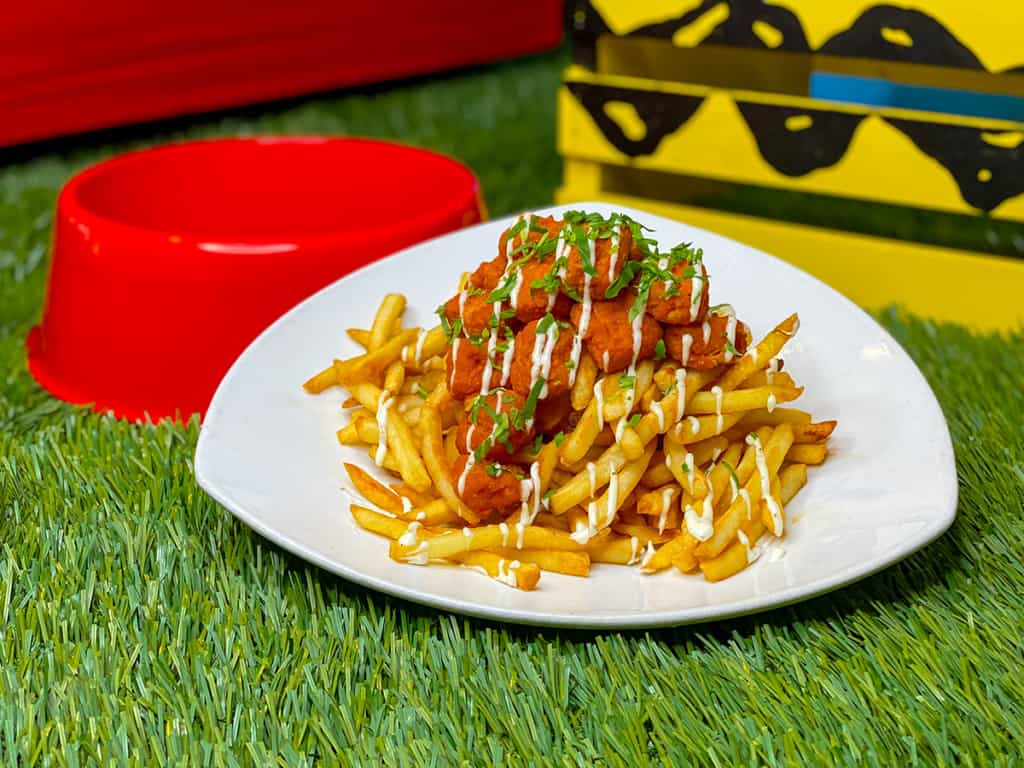 Wah Wah Wah Buffalo Popcorn Chicken Loaded Fries (Meal Plan Eligible) 
Pile of fries topped with buffalo popcorn chicken and ranch dressing drizzle
